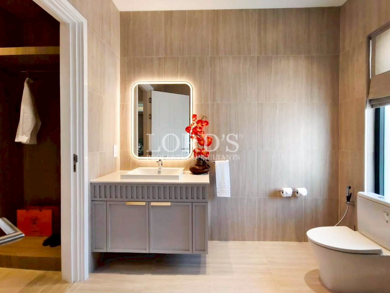 Modern bathroom vanity with illuminated mirror