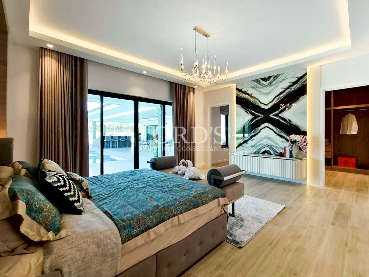 Modern bedroom with blue bedding and accent wall