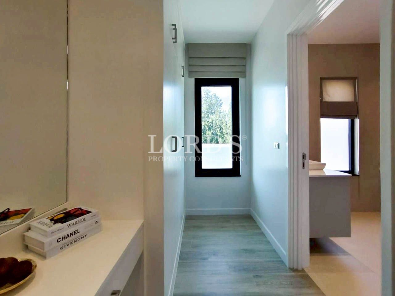 Minimalist bathroom hallway with modern fixtures