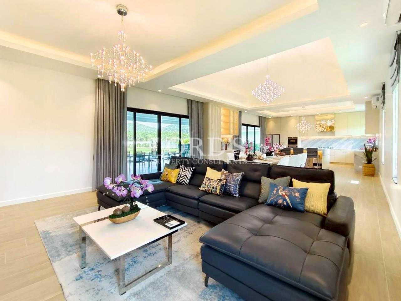 Luxury living room with large windows and sectional sofa