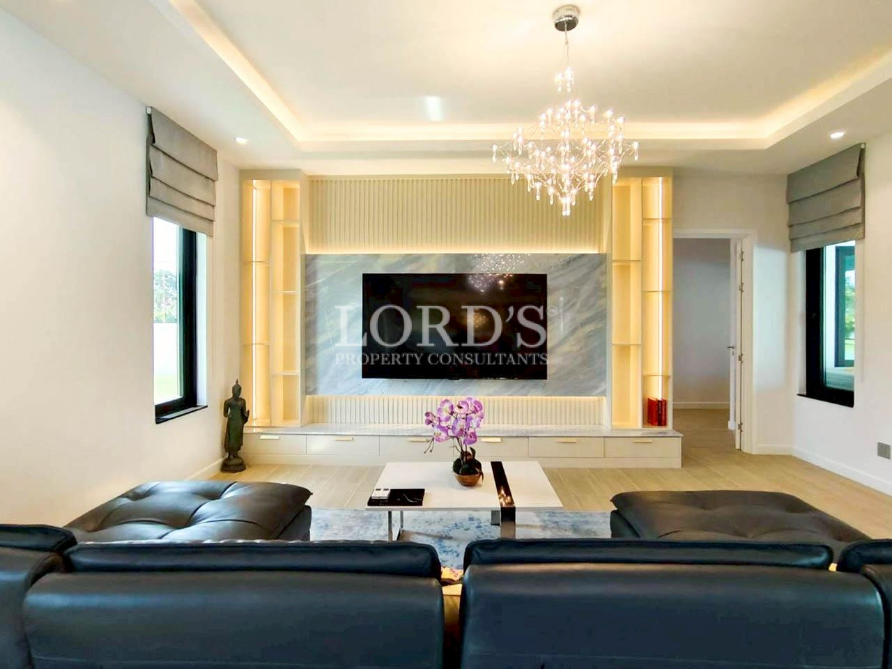 Modern living room with illuminated feature wall
