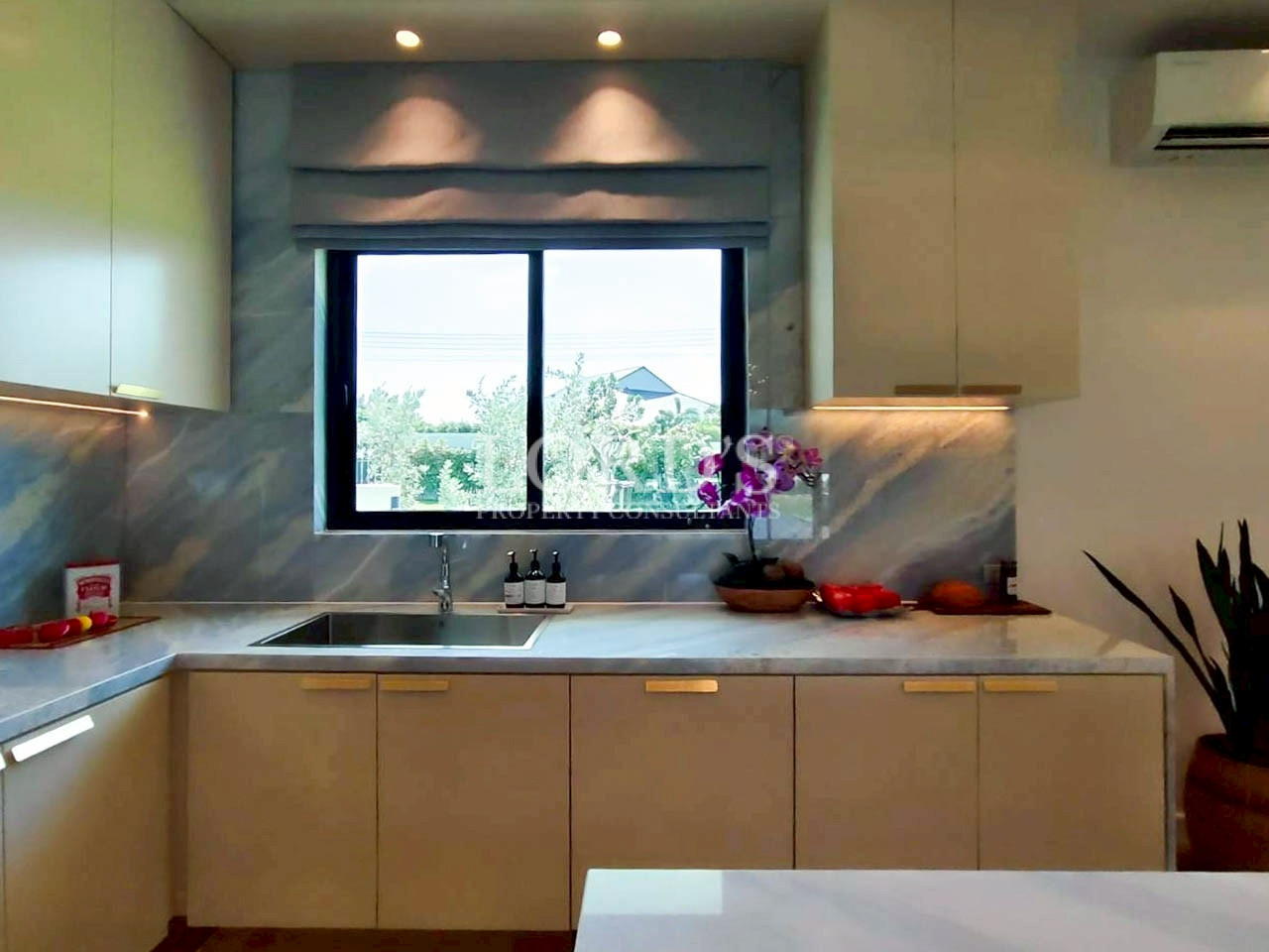 Decorative kitchen counter with window and warm lighting