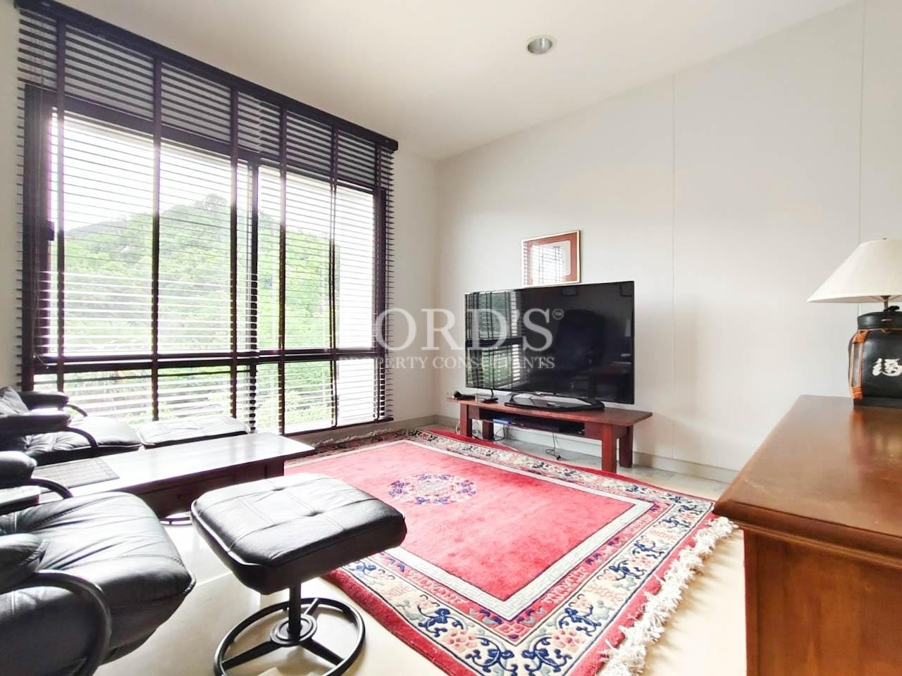 Home office with desk and TV
