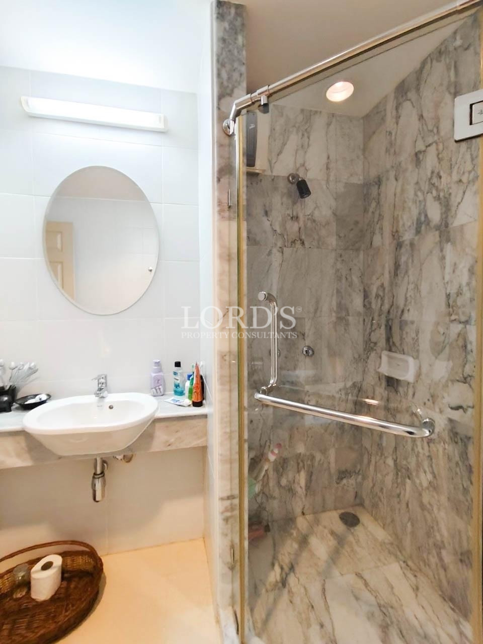 Modern bathroom with marble walls