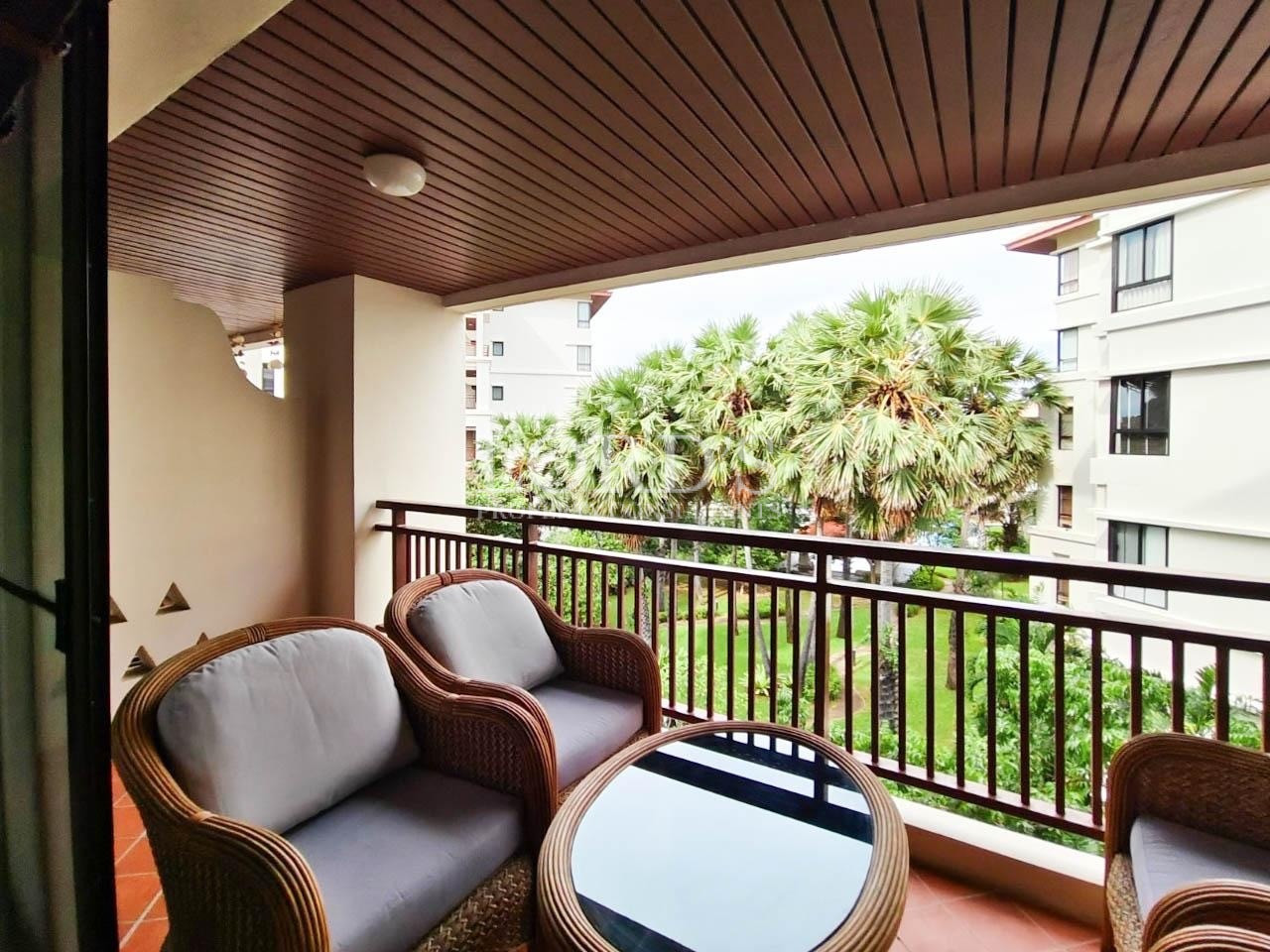Covered balcony with seating area