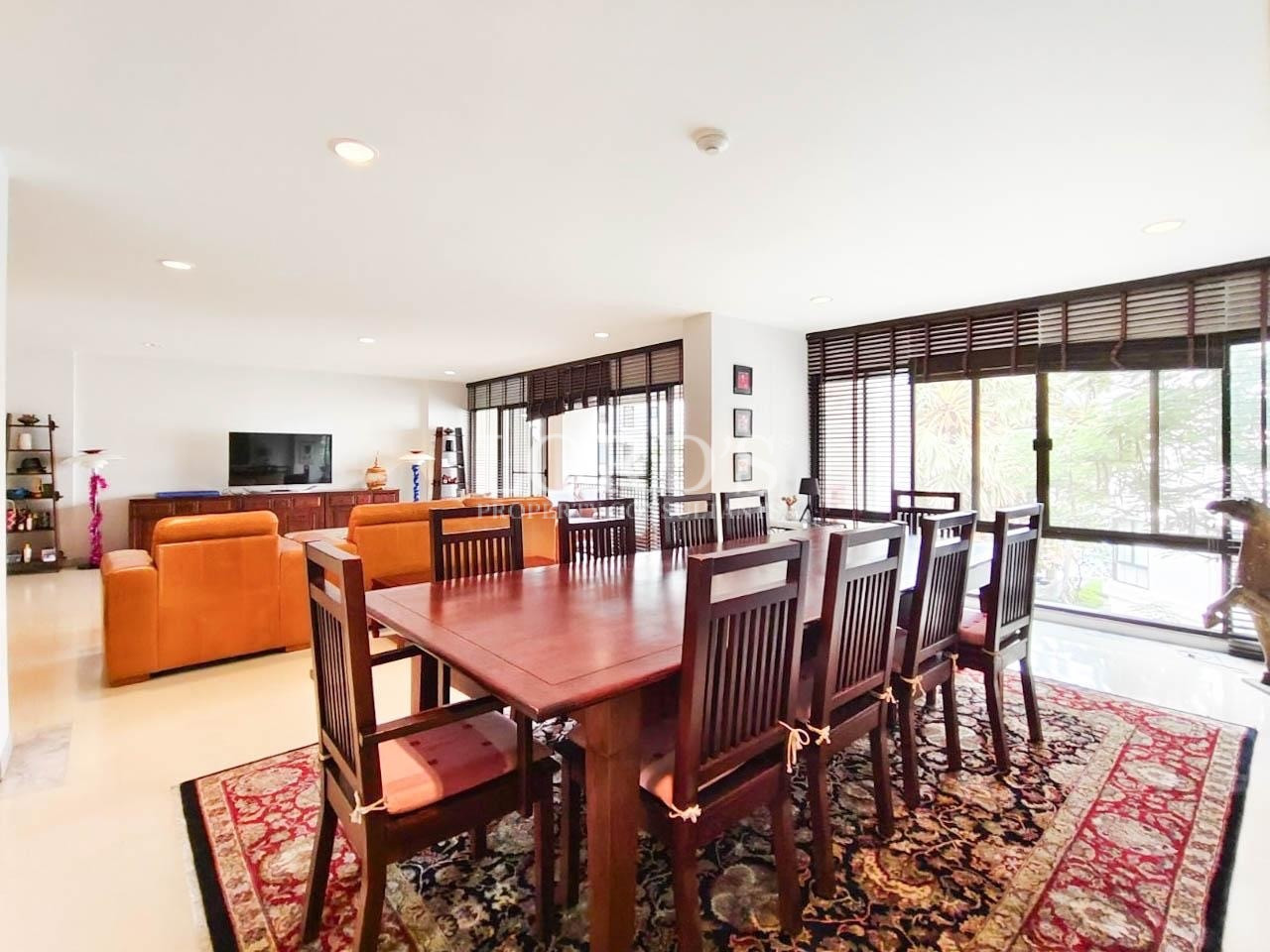 Spacious dining room with wooden furniture