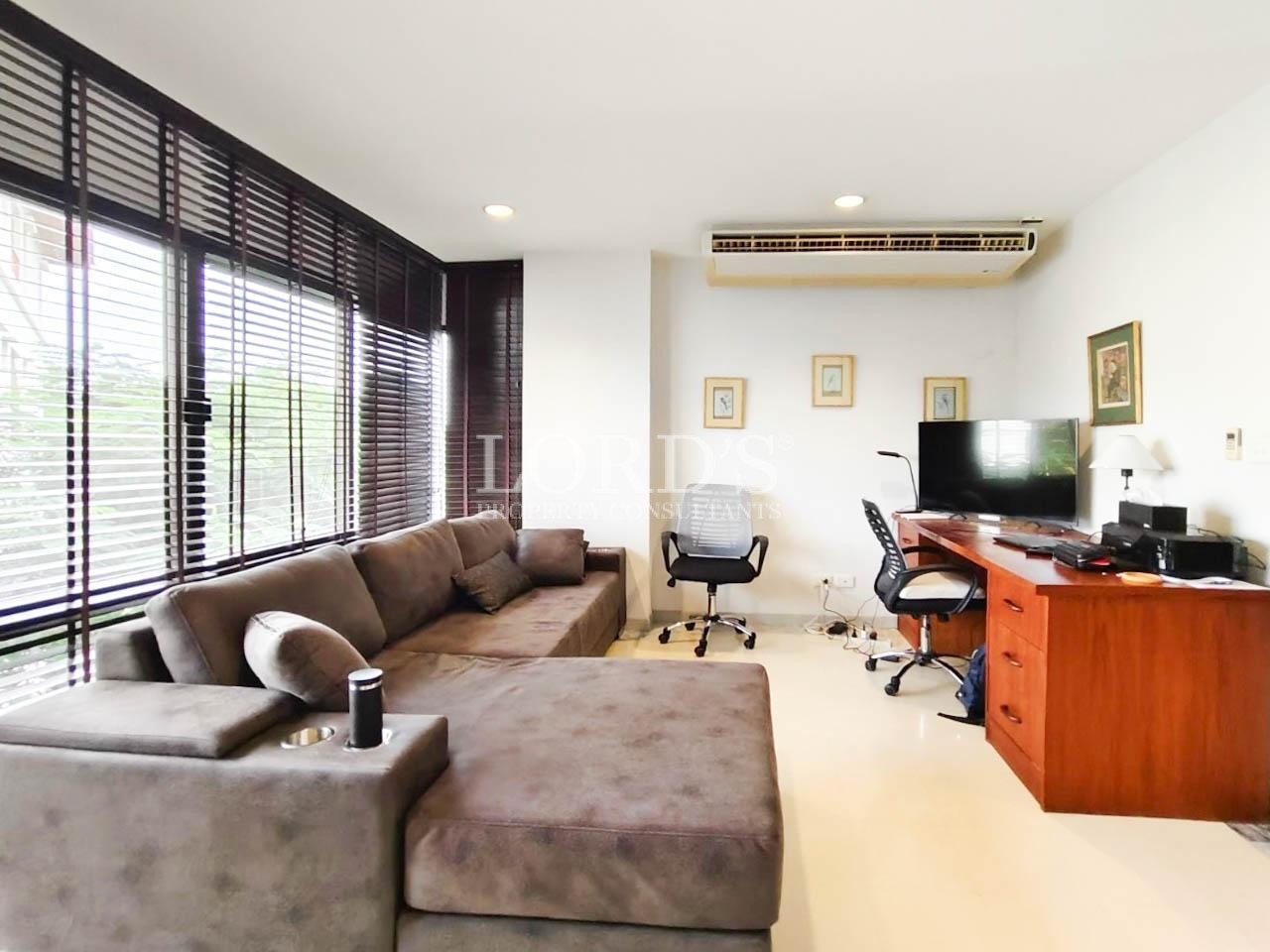 Spacious lounge with wooden furniture
