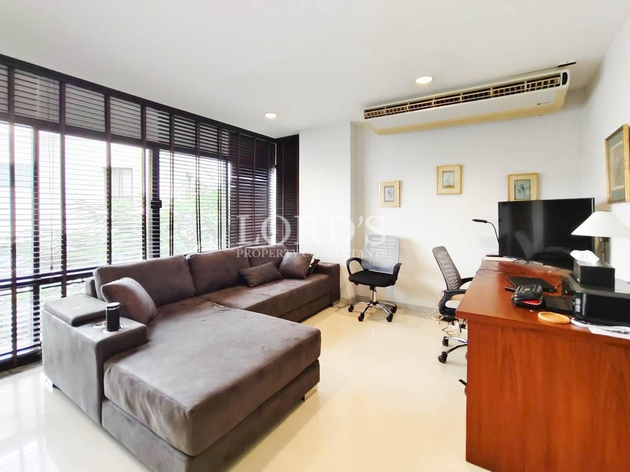 Living room with sectional sofa and TV