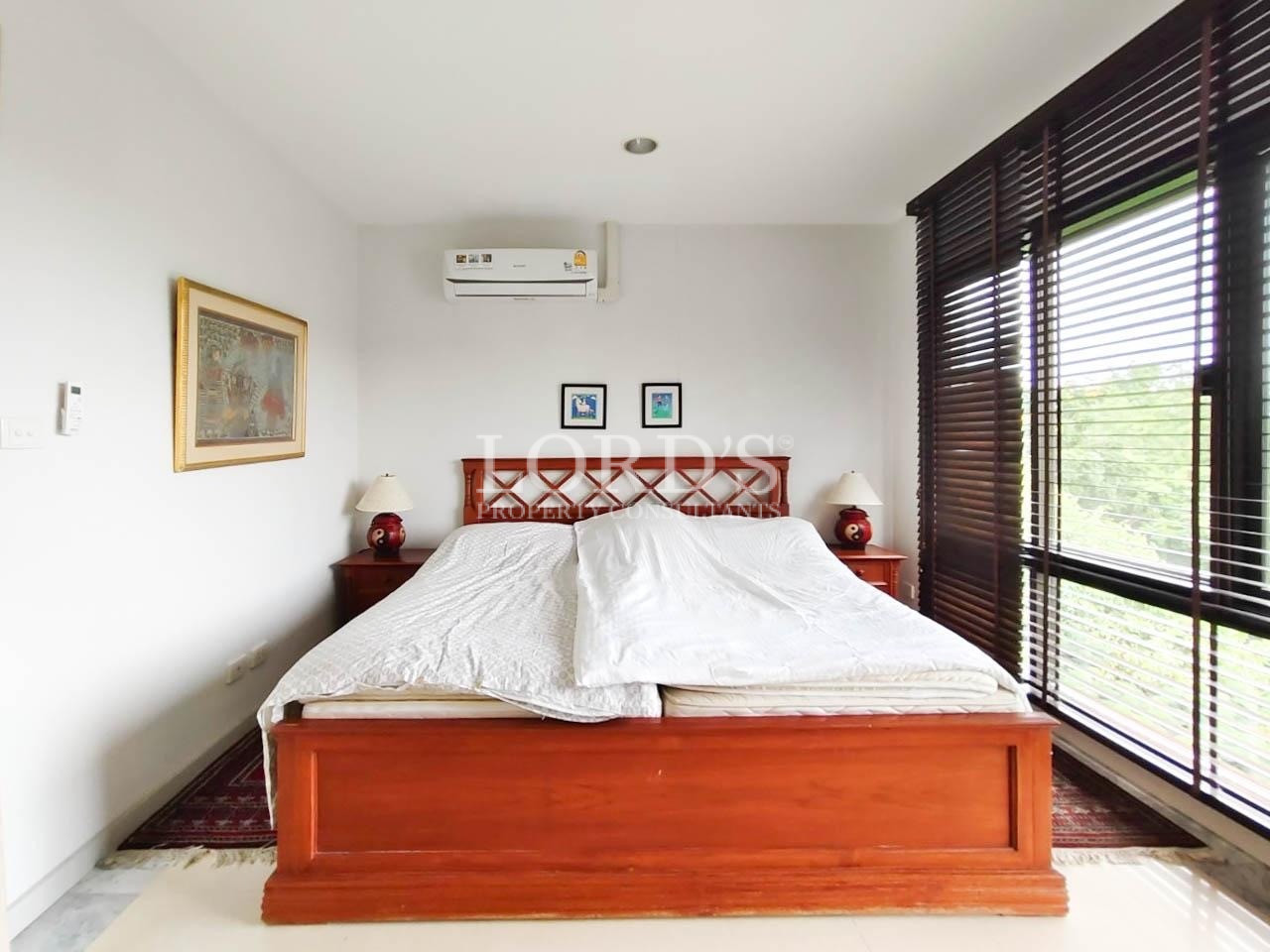 Bright bedroom with white bedding