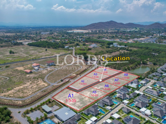 Aerial view of plotted land and surrounding roads