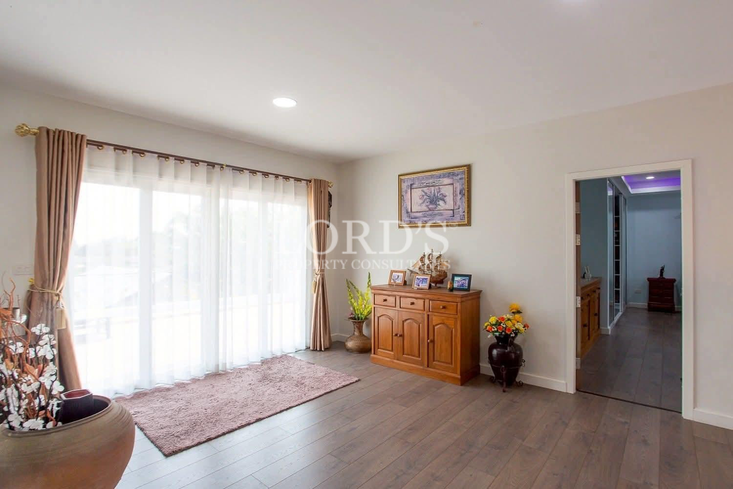 Bright living room with sheer curtains