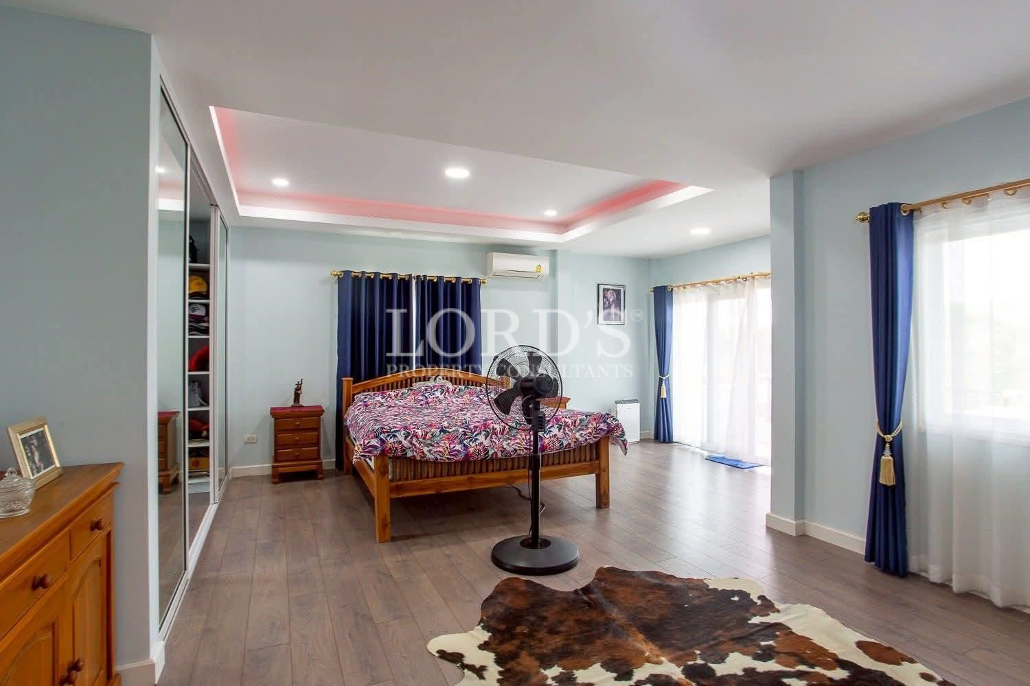 Bedroom with colorful ceiling lighting