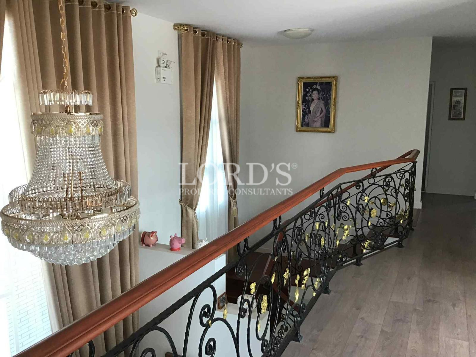 Staircase landing with decorative railing