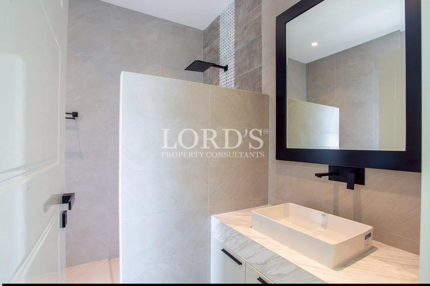 Bathroom with shower and vanity