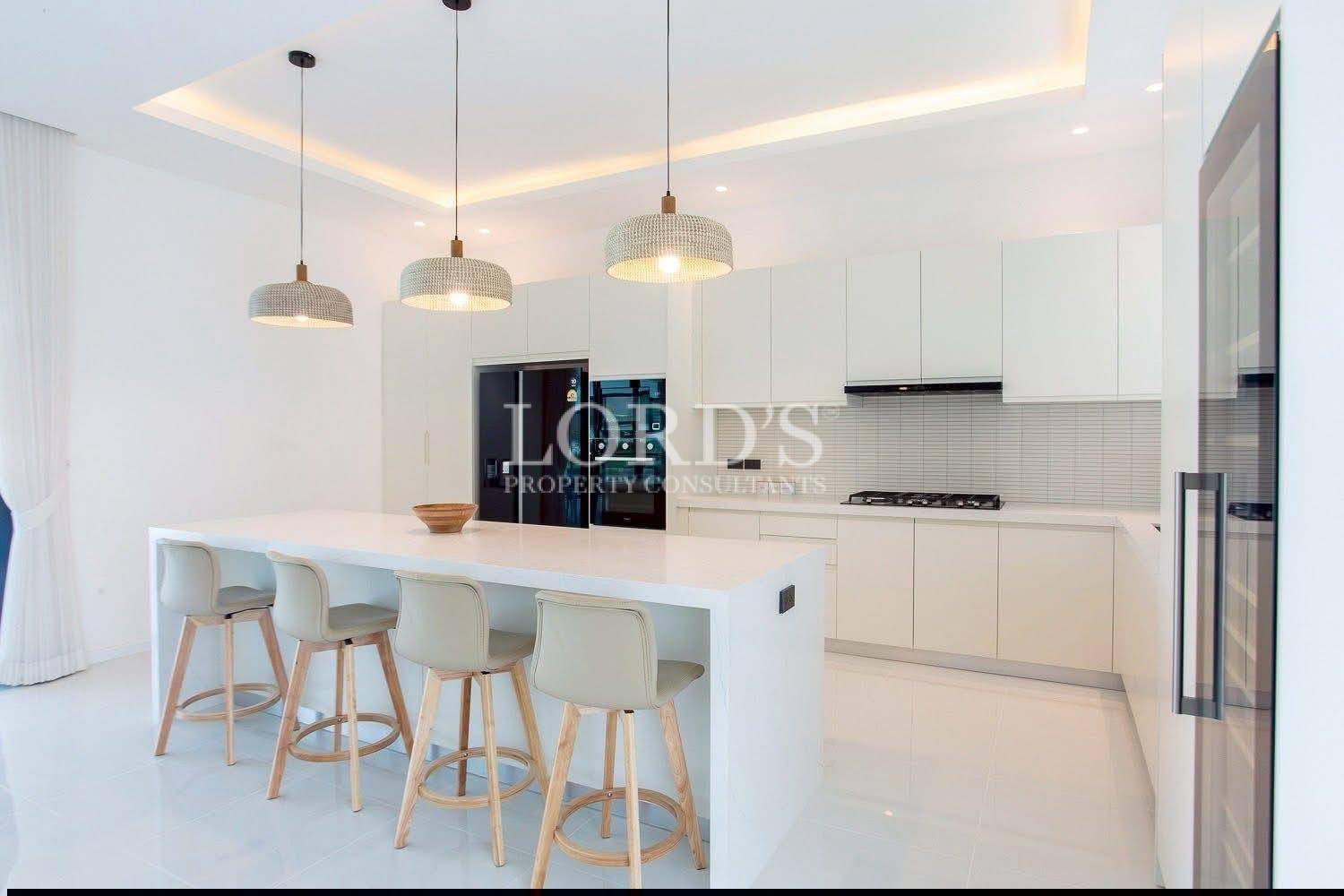 White kitchen with island seating