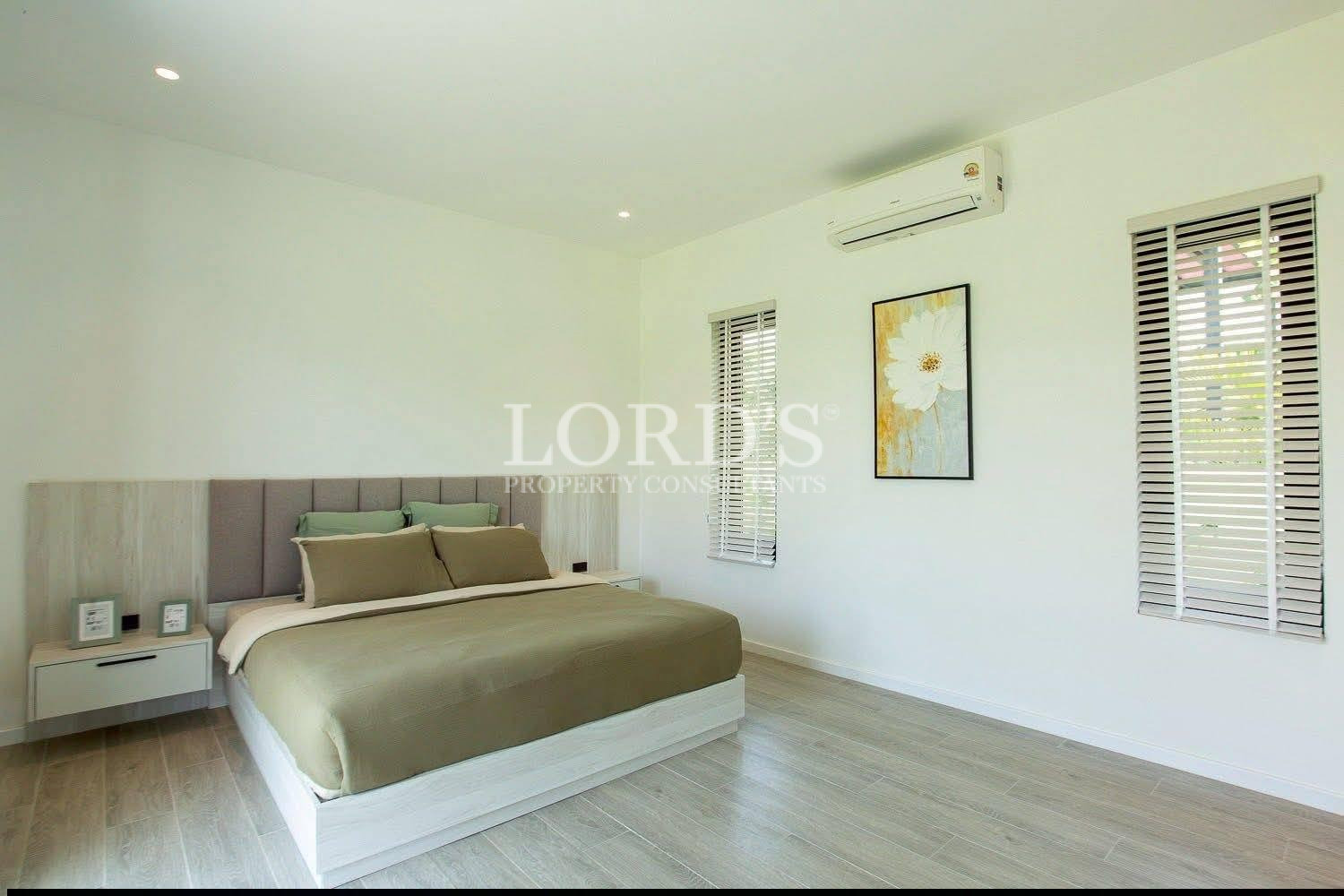 Minimalist bedroom with green bedding