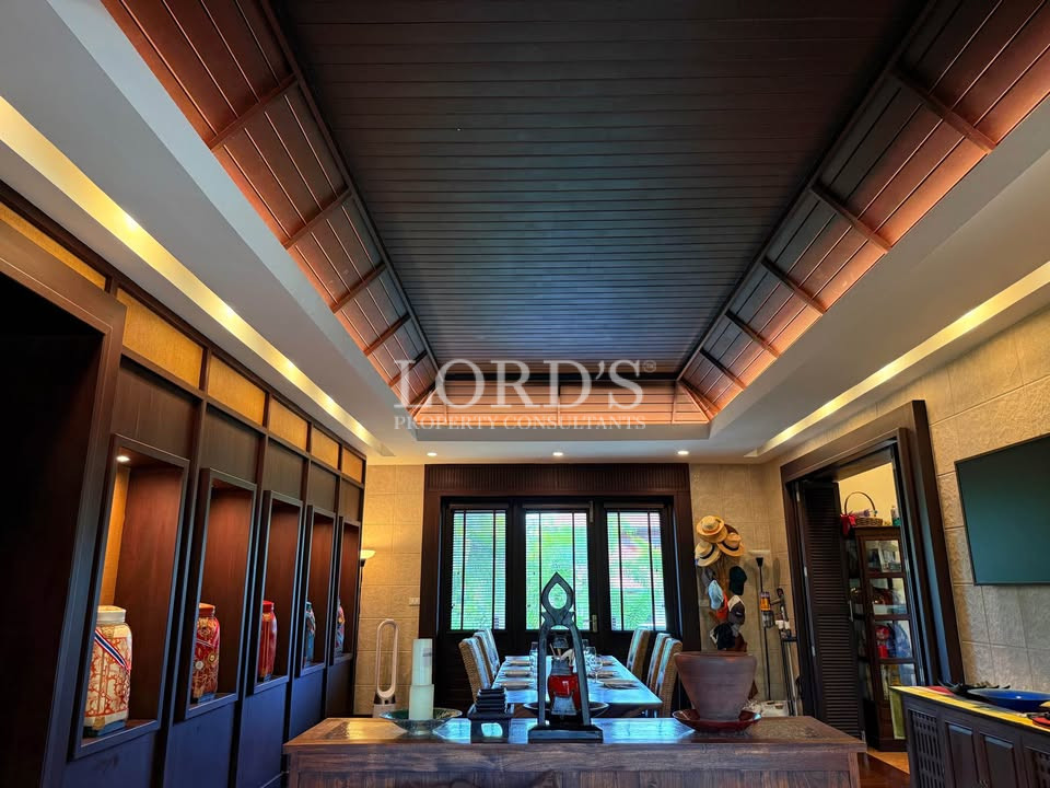 Luxury living room with dark wood ceiling