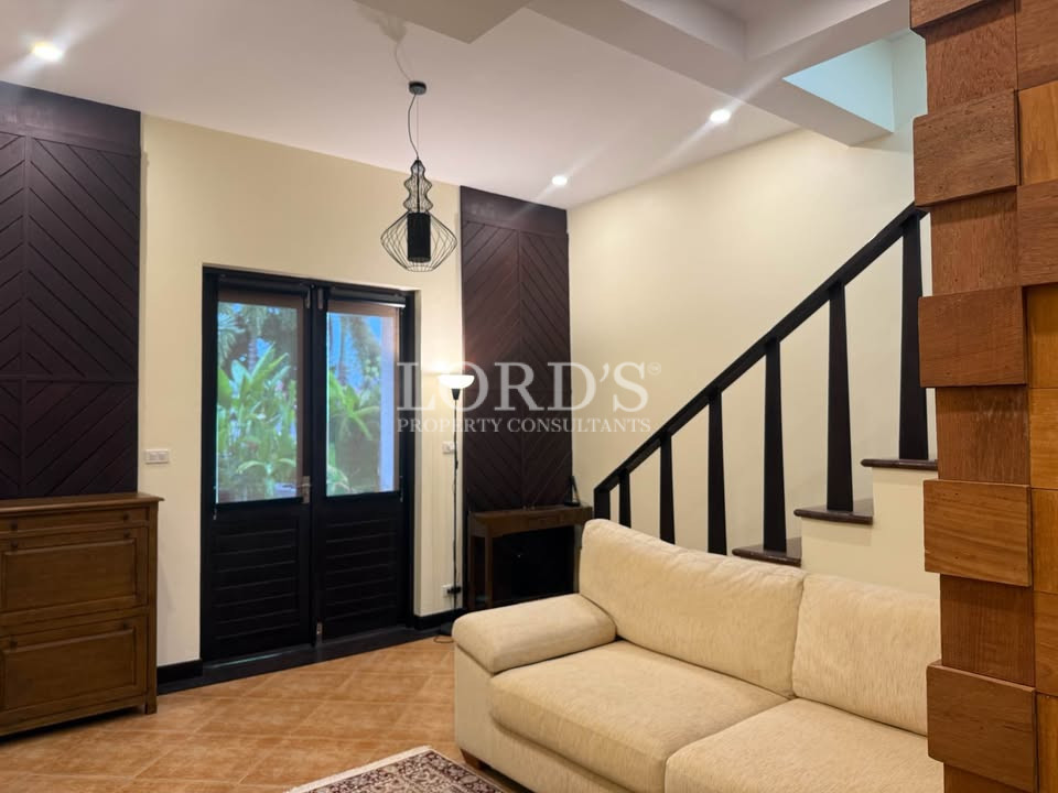 Modern staircase beside entrance door