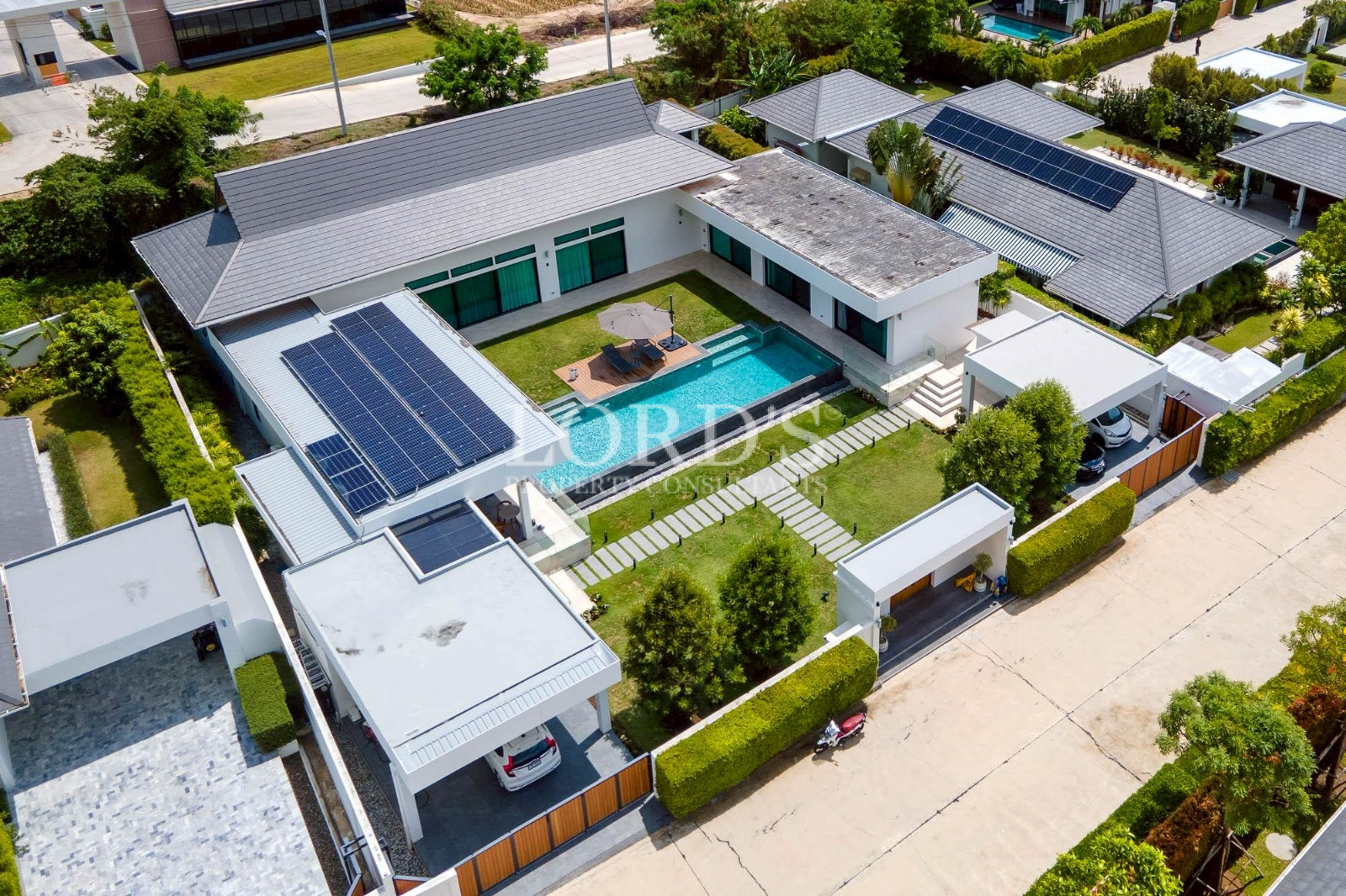 Modern villa with solar panels and swimming pool