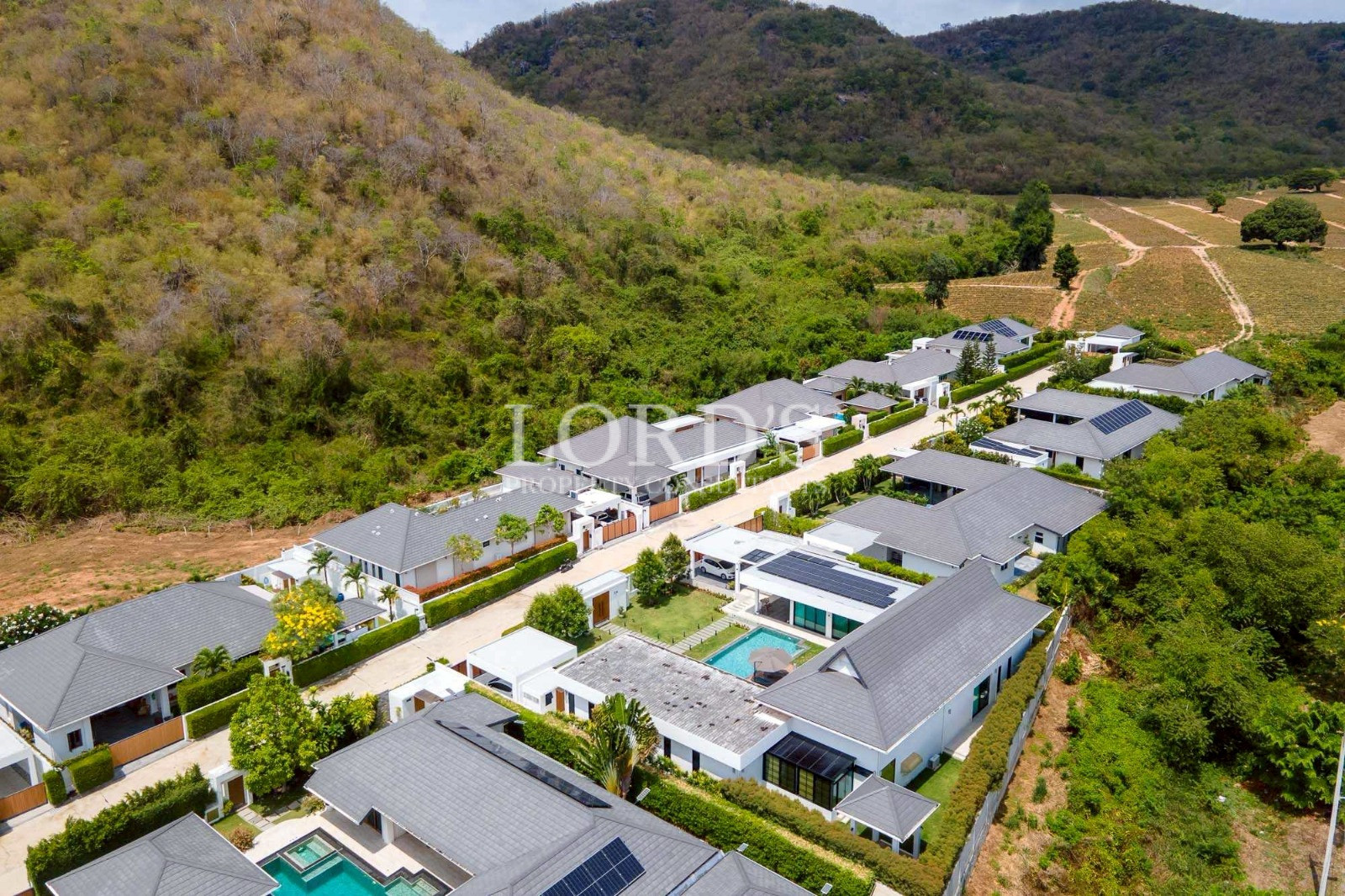 Aerial view of modern housing estate and hills