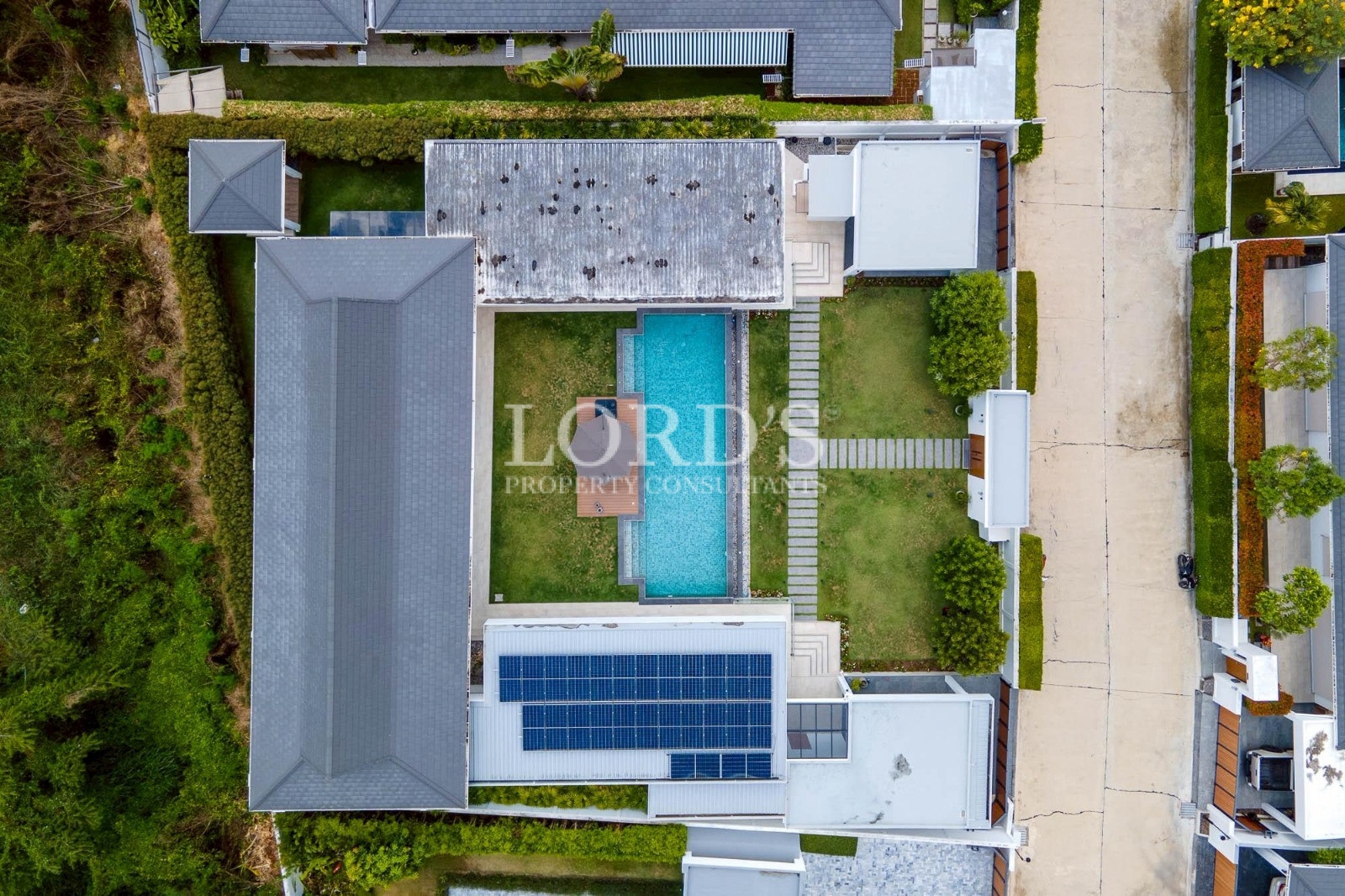 Aerial top view of luxury villa with pool