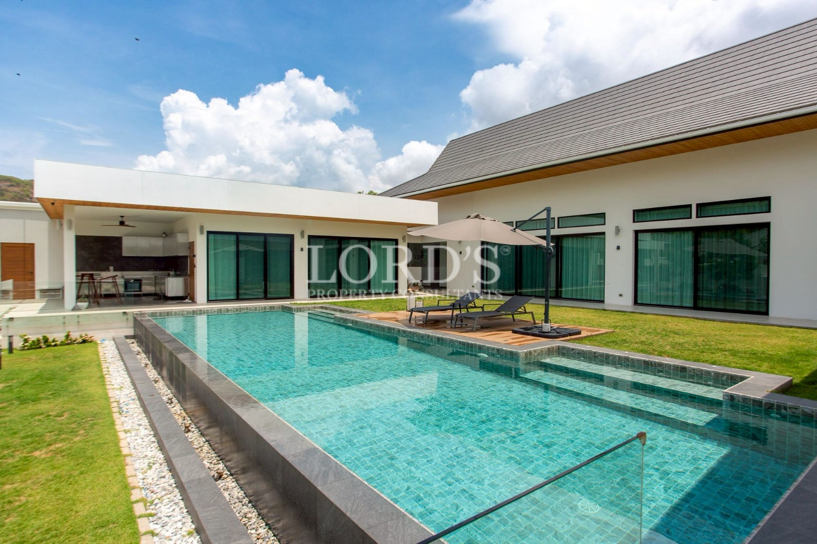 Modern villa with long swimming pool