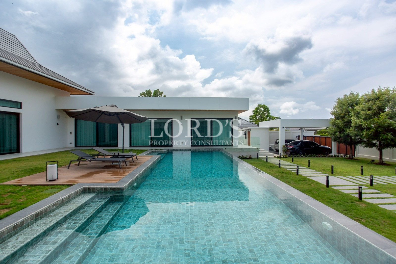 Infinity pool beside luxury villa