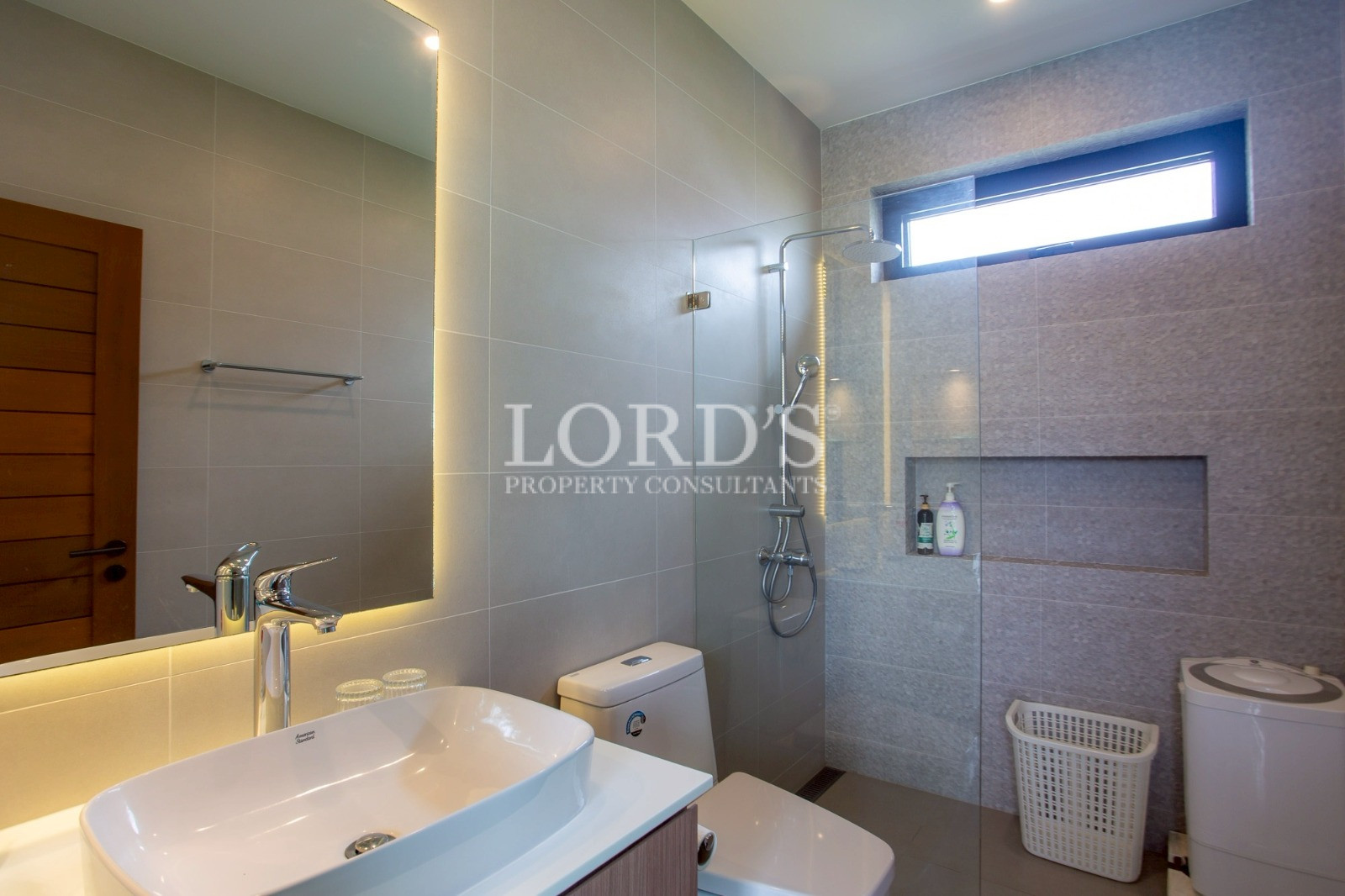 Modern bathroom with shower and vanity sink
