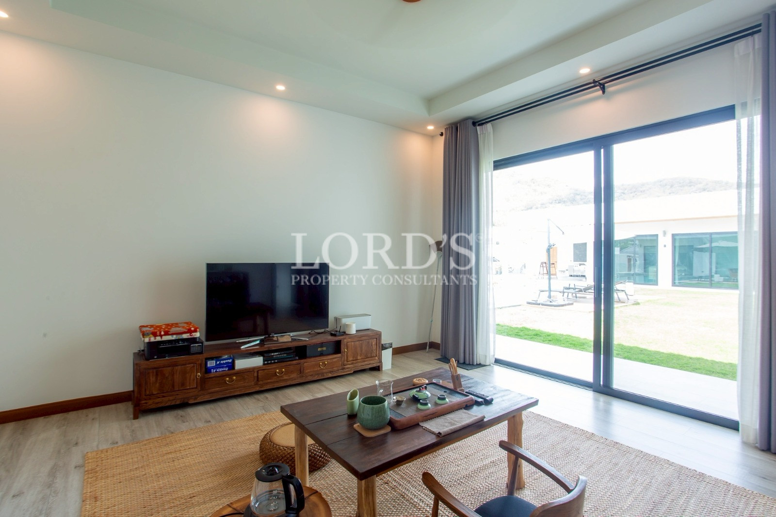 Living room with large glass doors and balcony access
