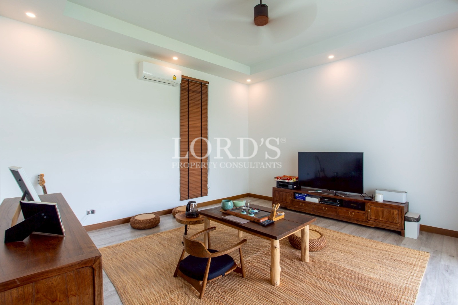 Modern living room with wooden furniture and TV
