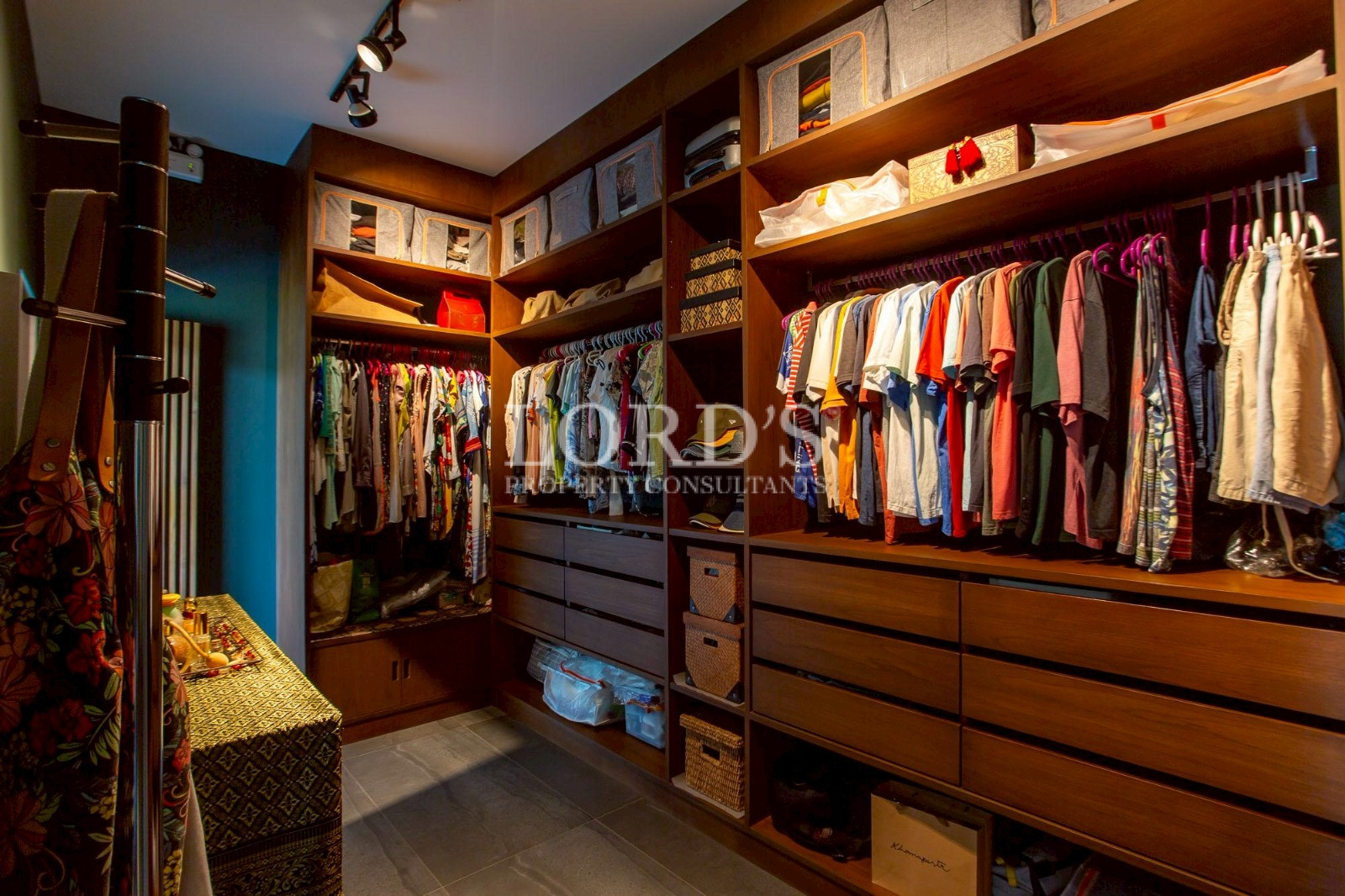 Walk-in closet with wooden cabinetry