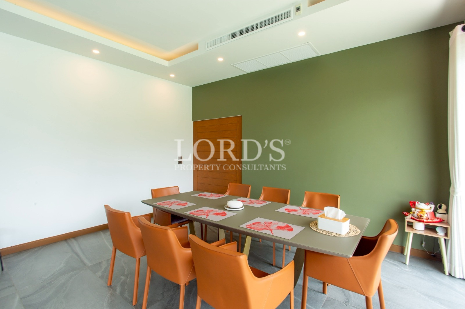 Dining room with orange chairs