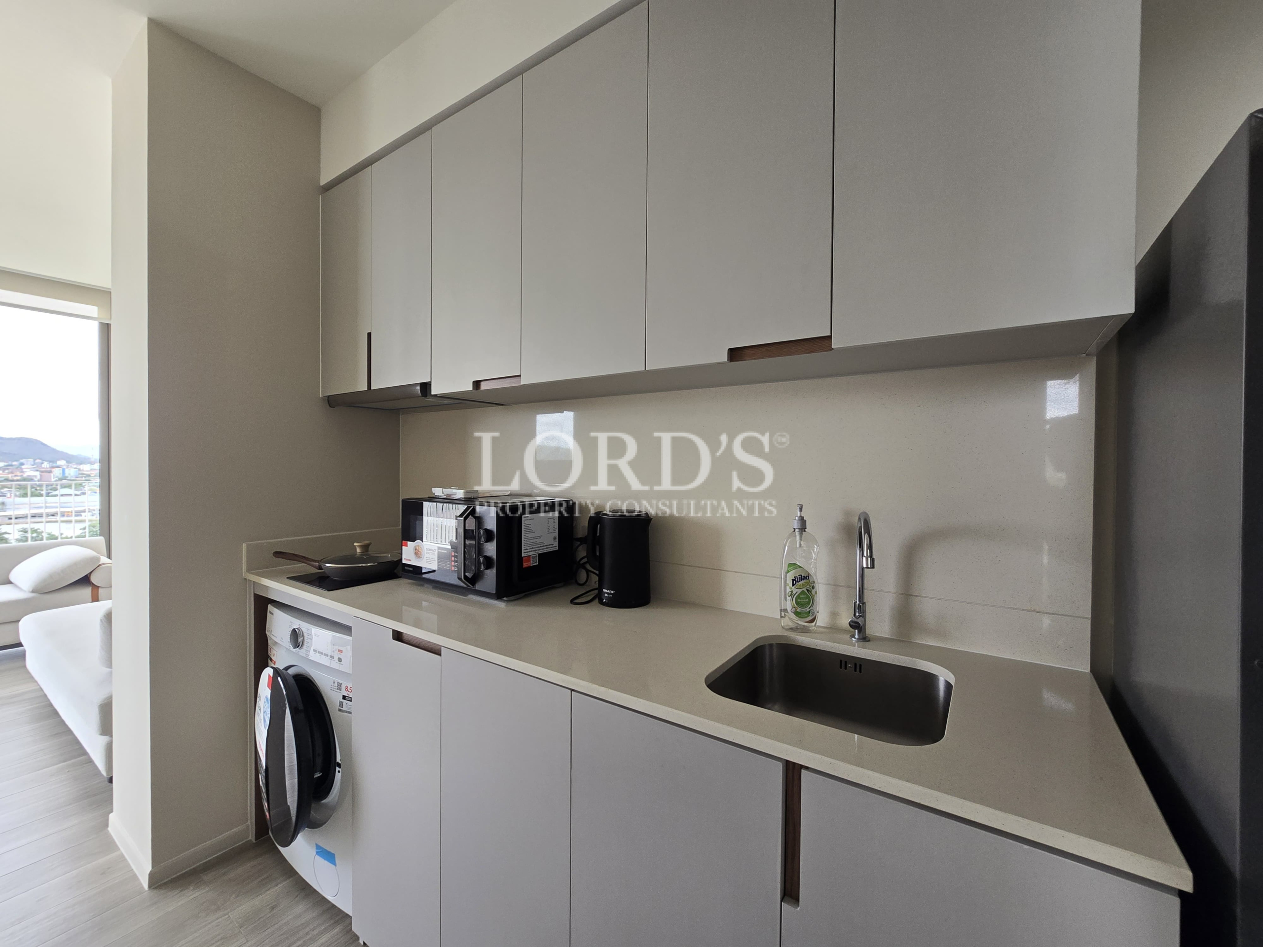 Compact kitchen with modern cabinets and appliances