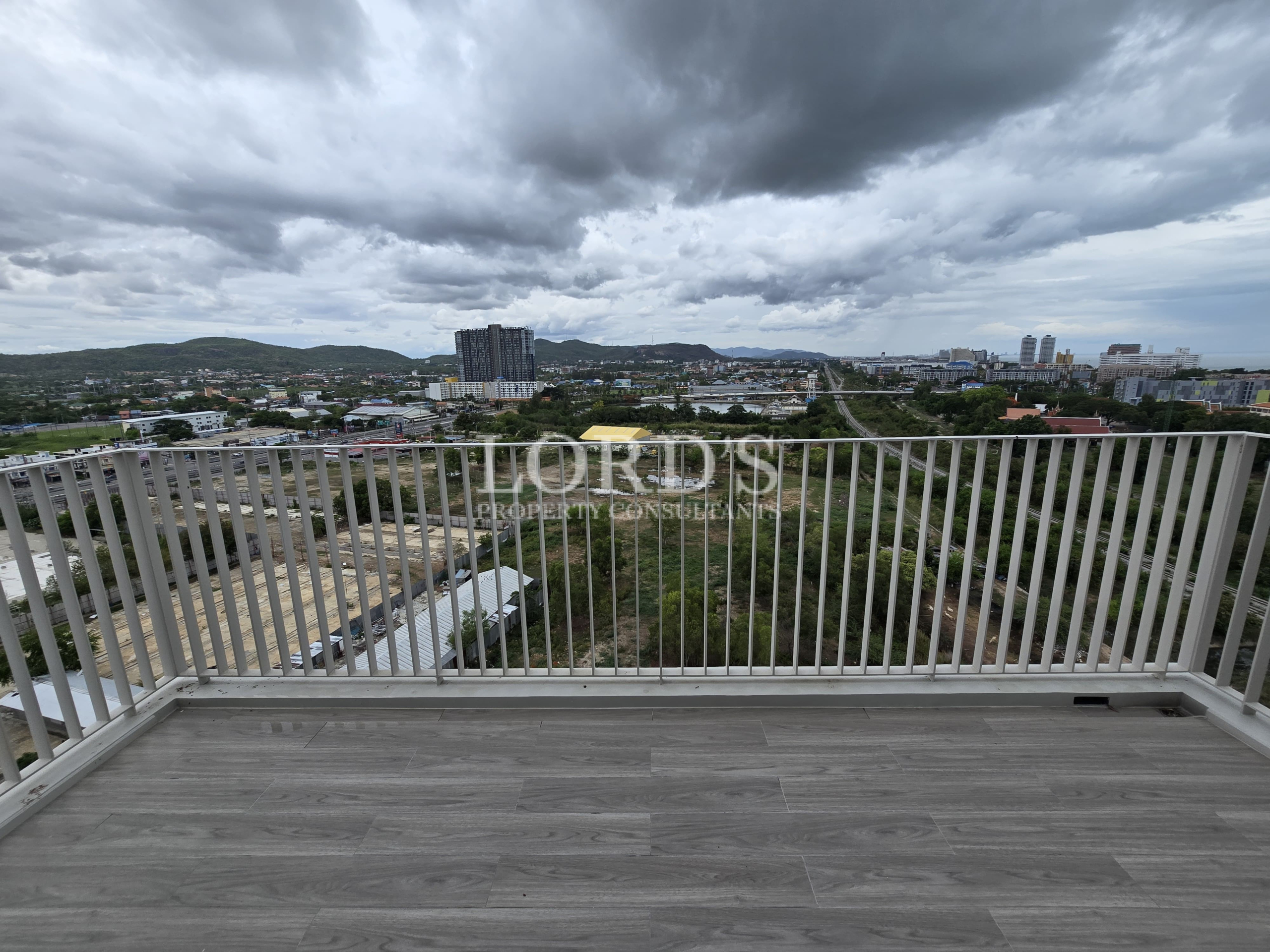 Balcony with panoramic city and mountain views