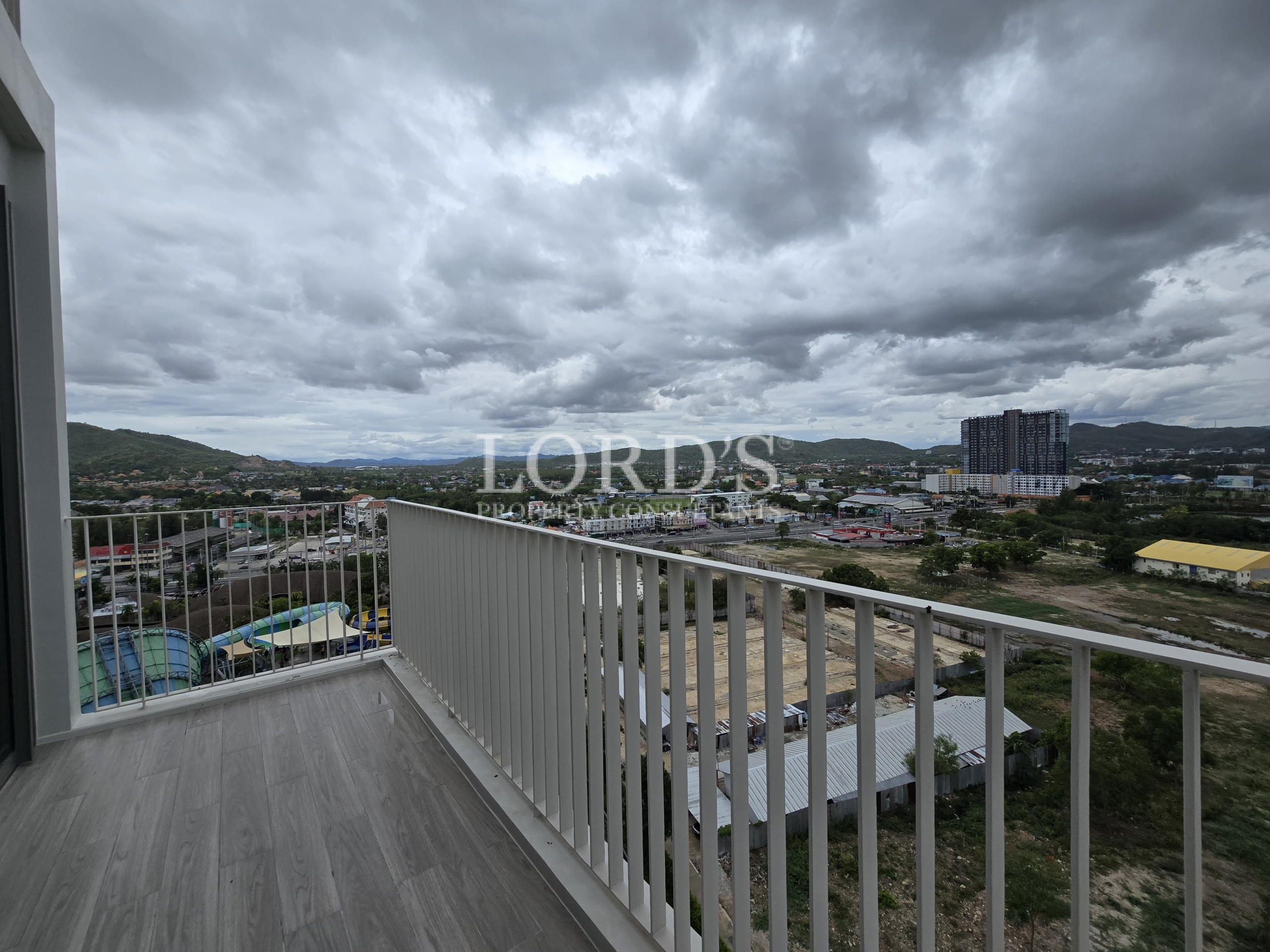 Balcony with cloudy skyline and railing