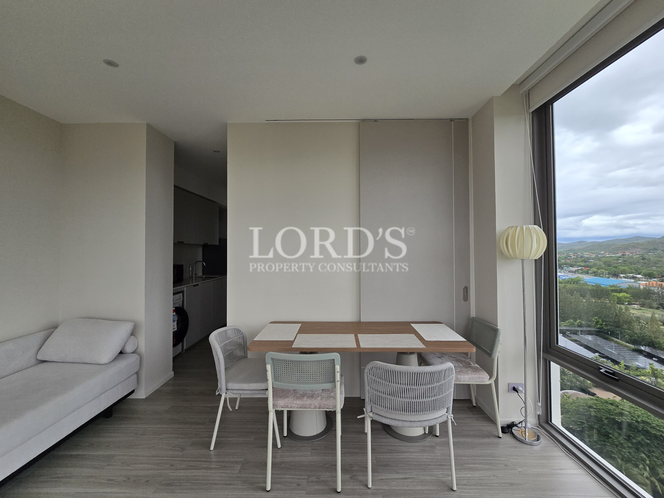 Dining space with modern table and large windows