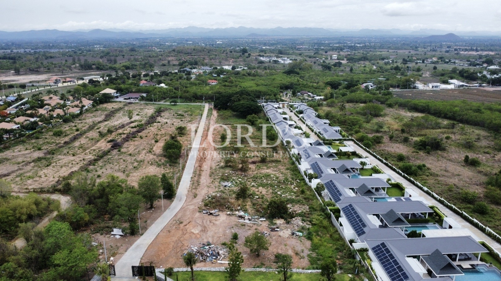Aerial view of residential area and surrounding landscape