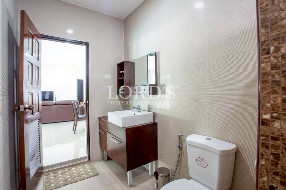 Minimalist bathroom with vanity and large mirror
