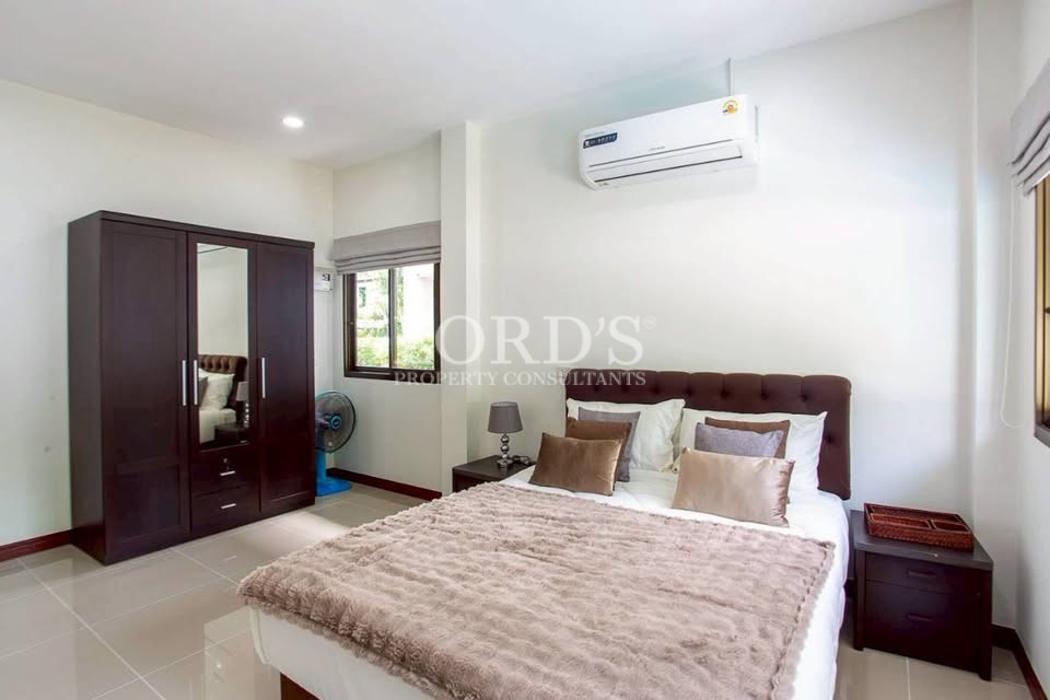Modern bedroom with air conditioning and large windows