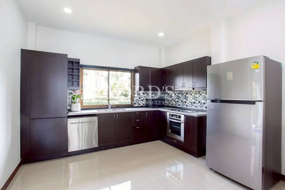 Contemporary kitchen with garden-view windows