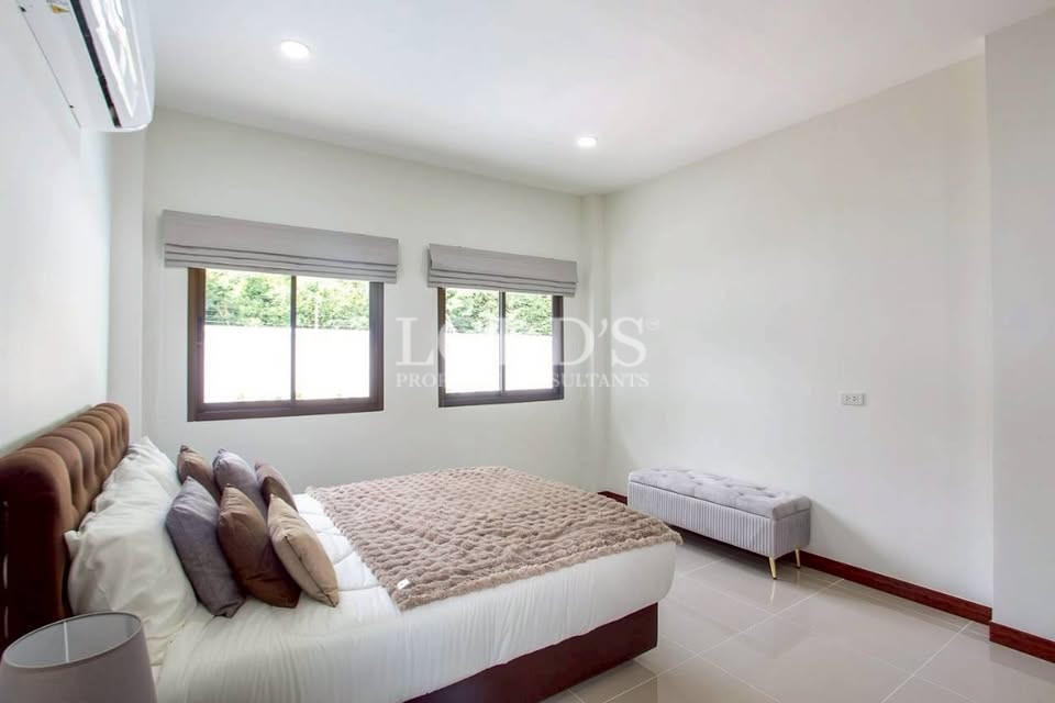 Bright unfurnished room with large windows
