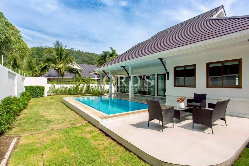Tropical villa exterior with landscaped garden