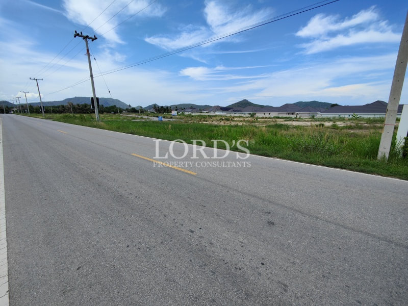 Roadside land plot with mountain views