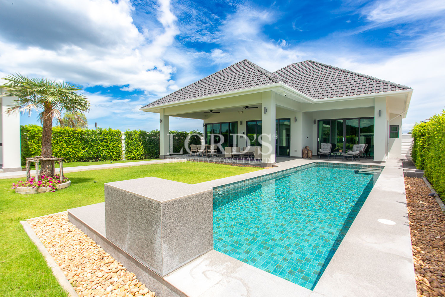 Poolside terrace with contemporary villa