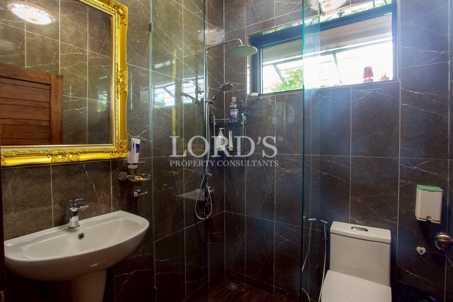 Bathroom with illuminated vanity mirror