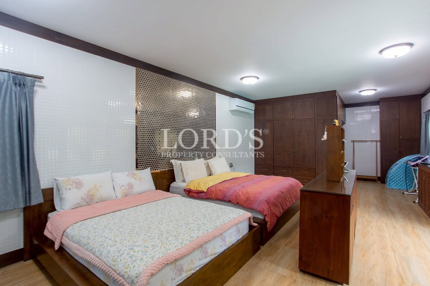 Bedroom with wood-paneled accent wall