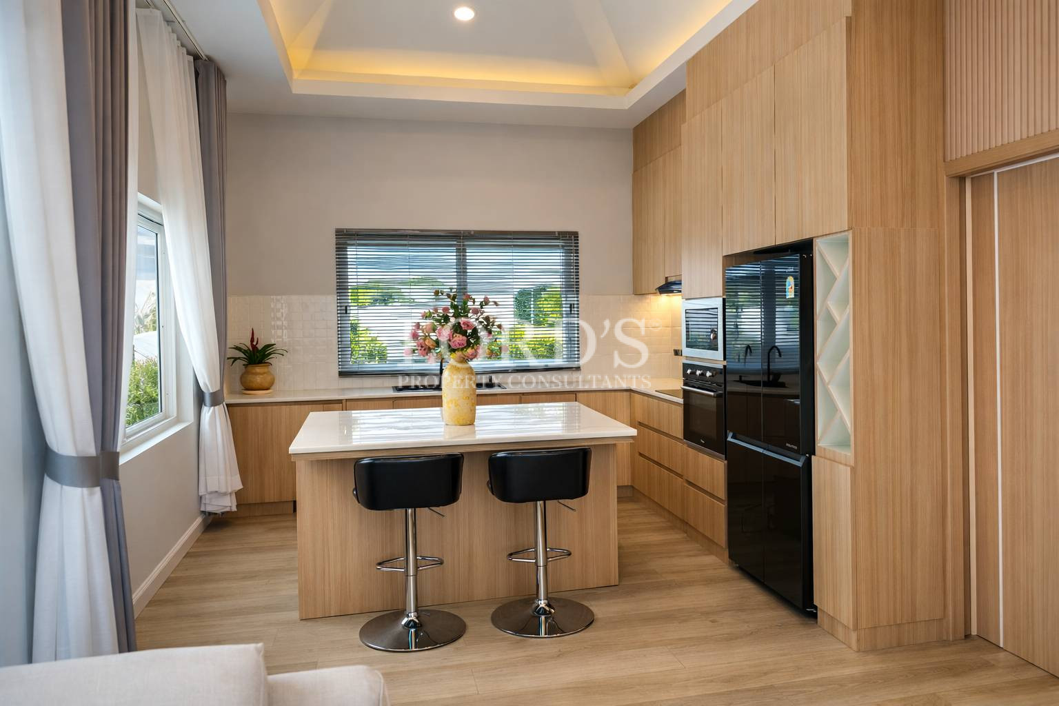 Modern kitchen with island and bar stools