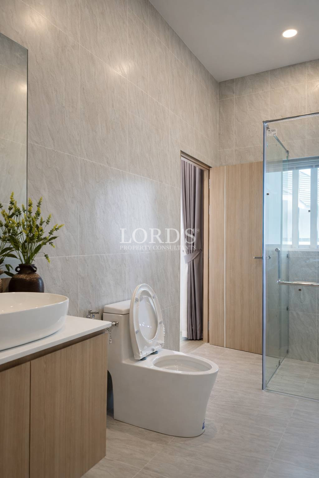 Bathroom with vanity and shower area