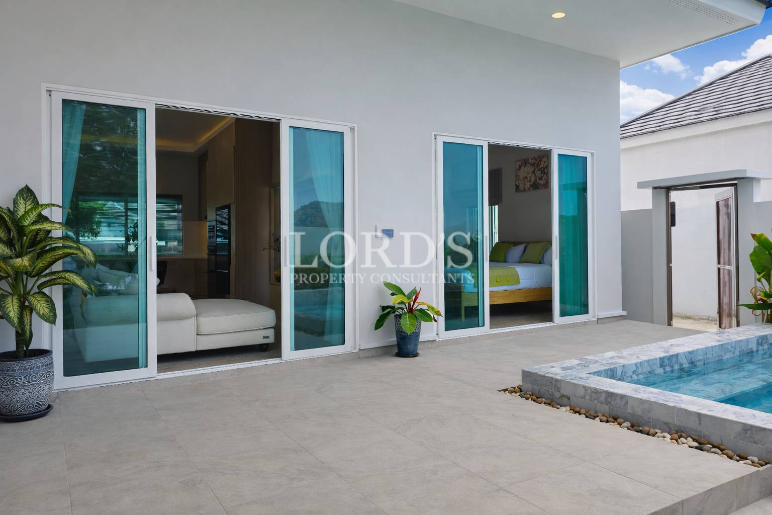 Modern villa entrance with glass doors