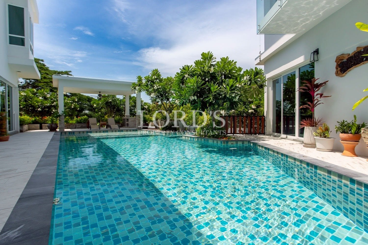 Swimming pool with modern villa exterior
